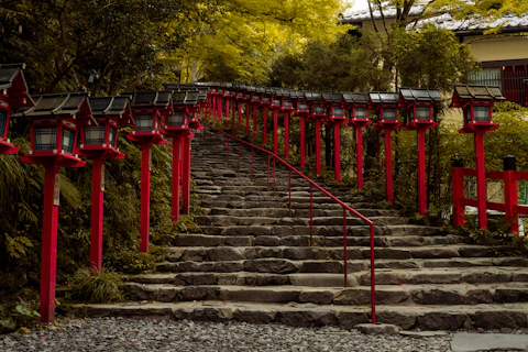 Red lanterns line the stone steps.