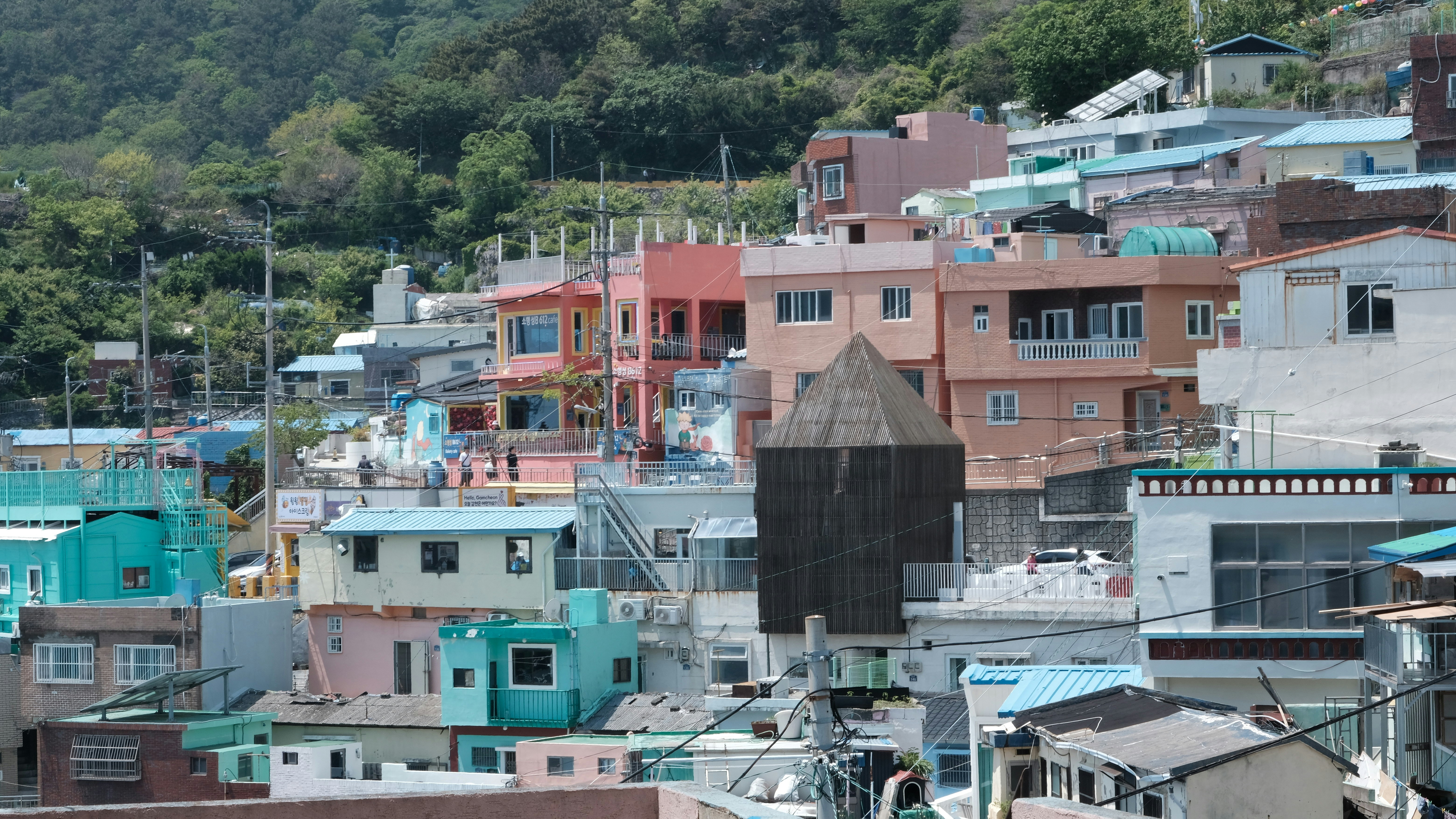 Colorful houses are nestled on a hillside.
