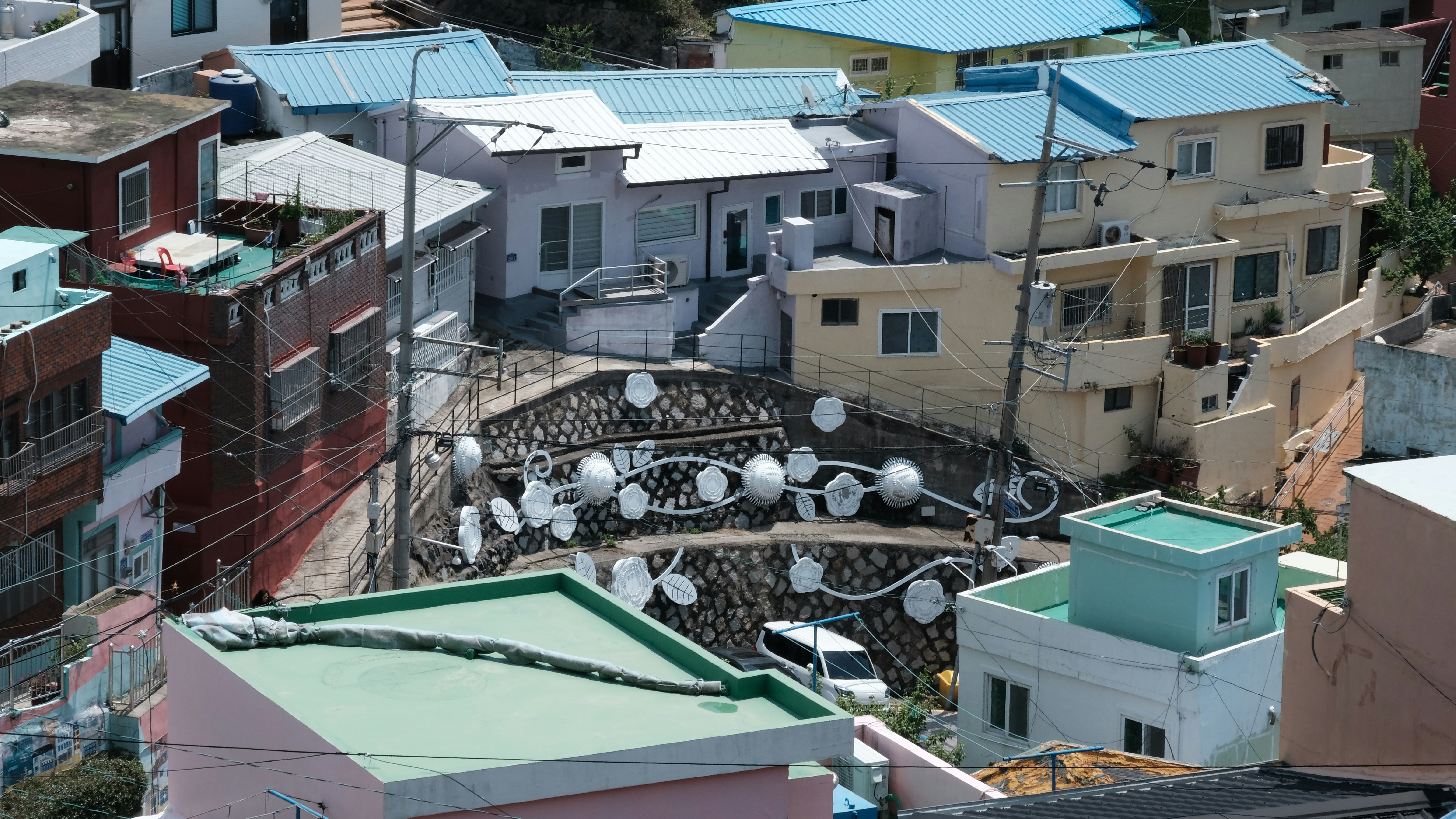 Colorful houses are clustered on a hillside