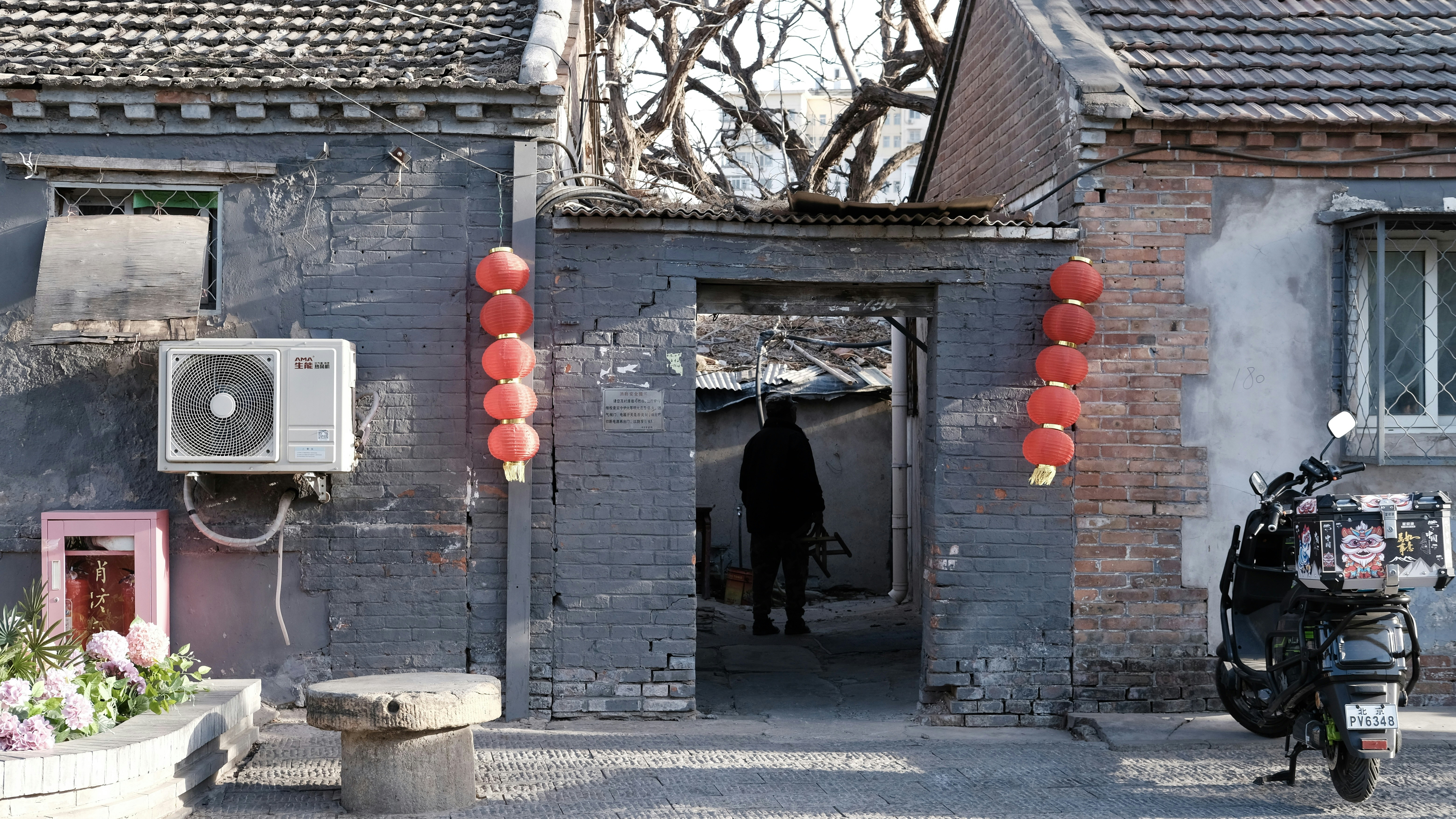 Old building entrance decorated with red lanterns