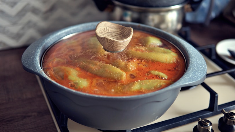 Stew simmering in a pot on the stovetop.