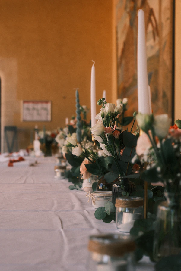 Elegant reception table with white flowers and candles