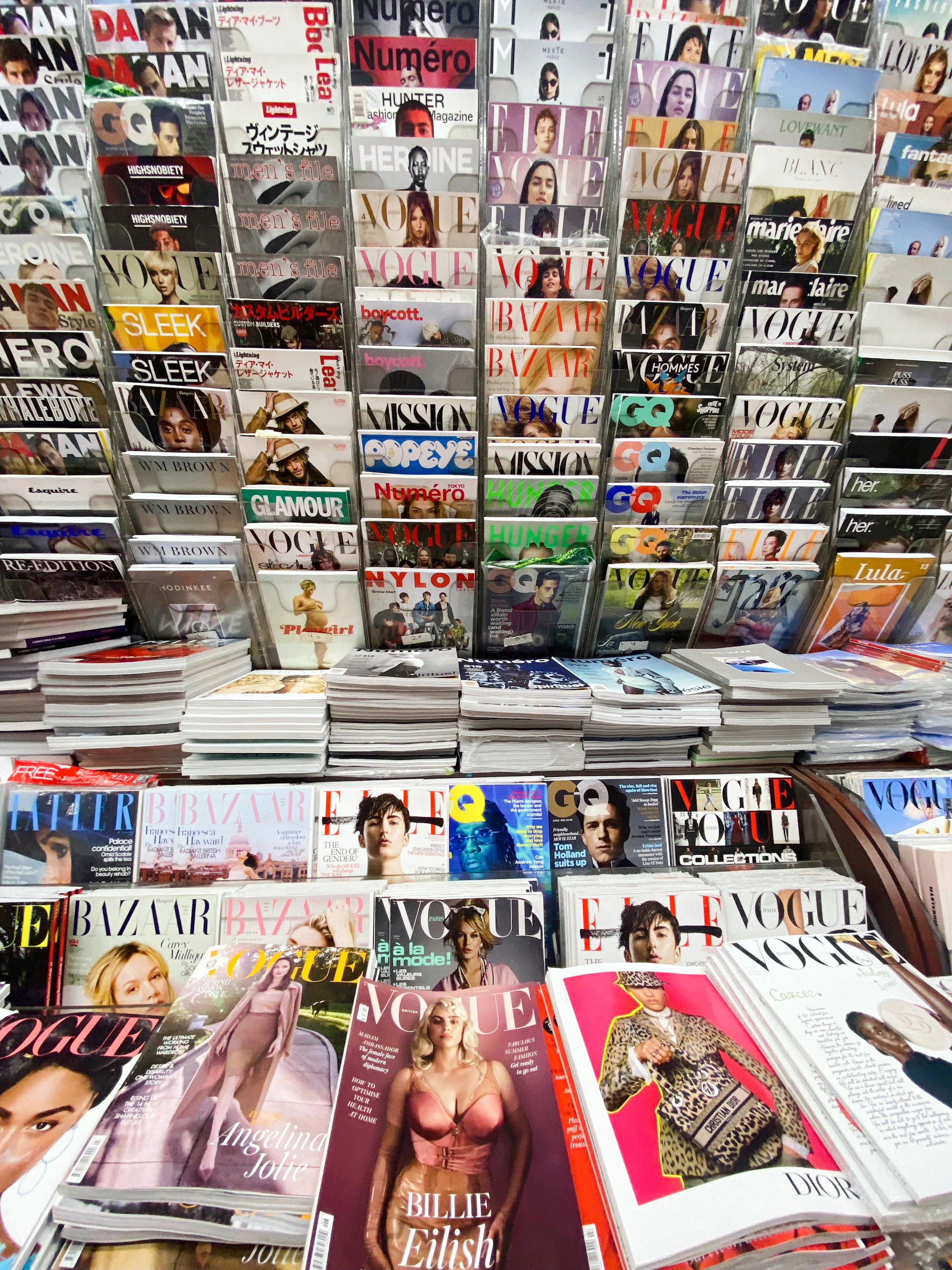 Magazines are neatly displayed in a shop.