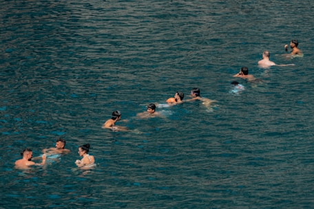 People are swimming in the sea.
