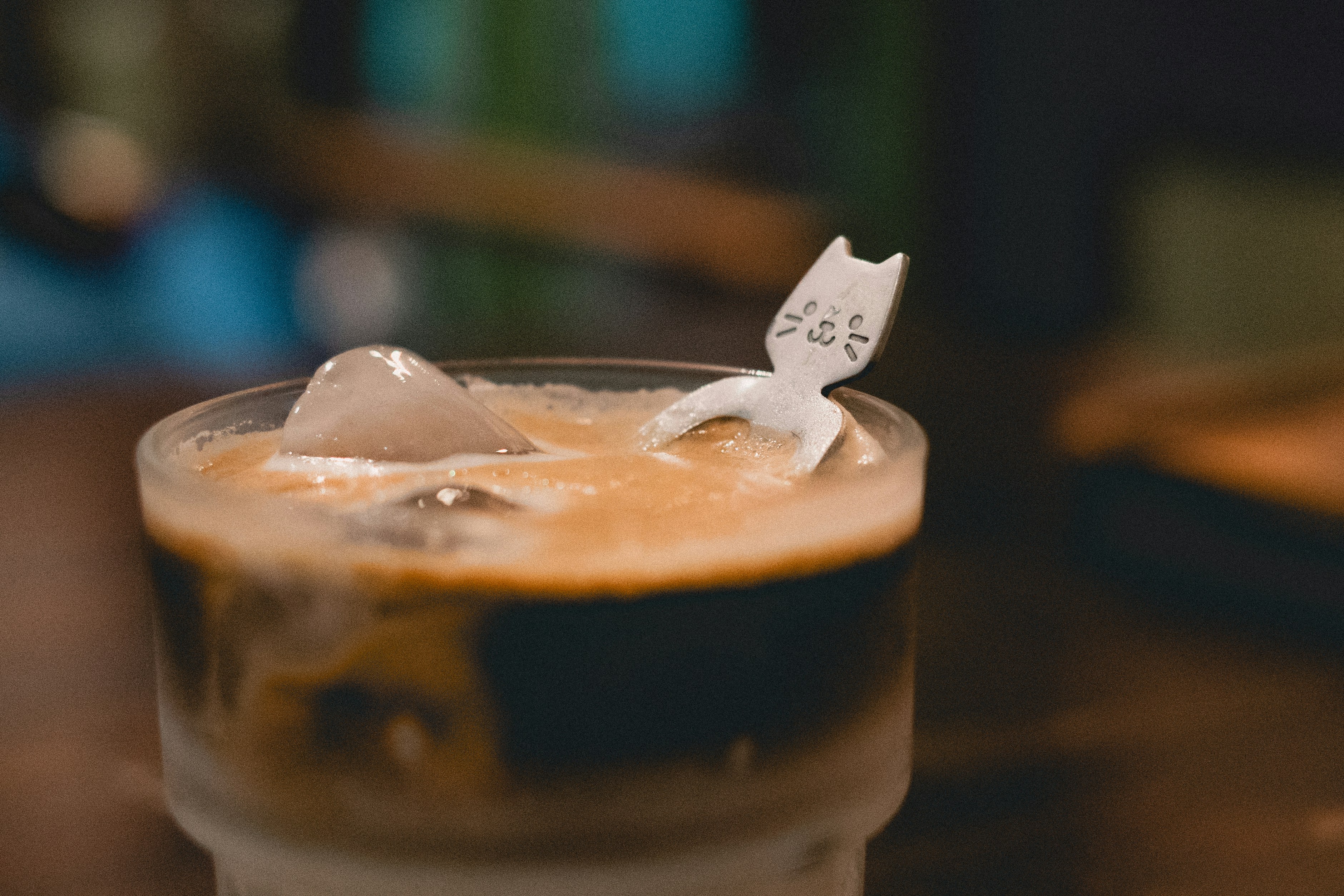 Iced coffee topped with a cat decoration