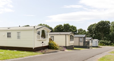 Several static caravans are parked along a road