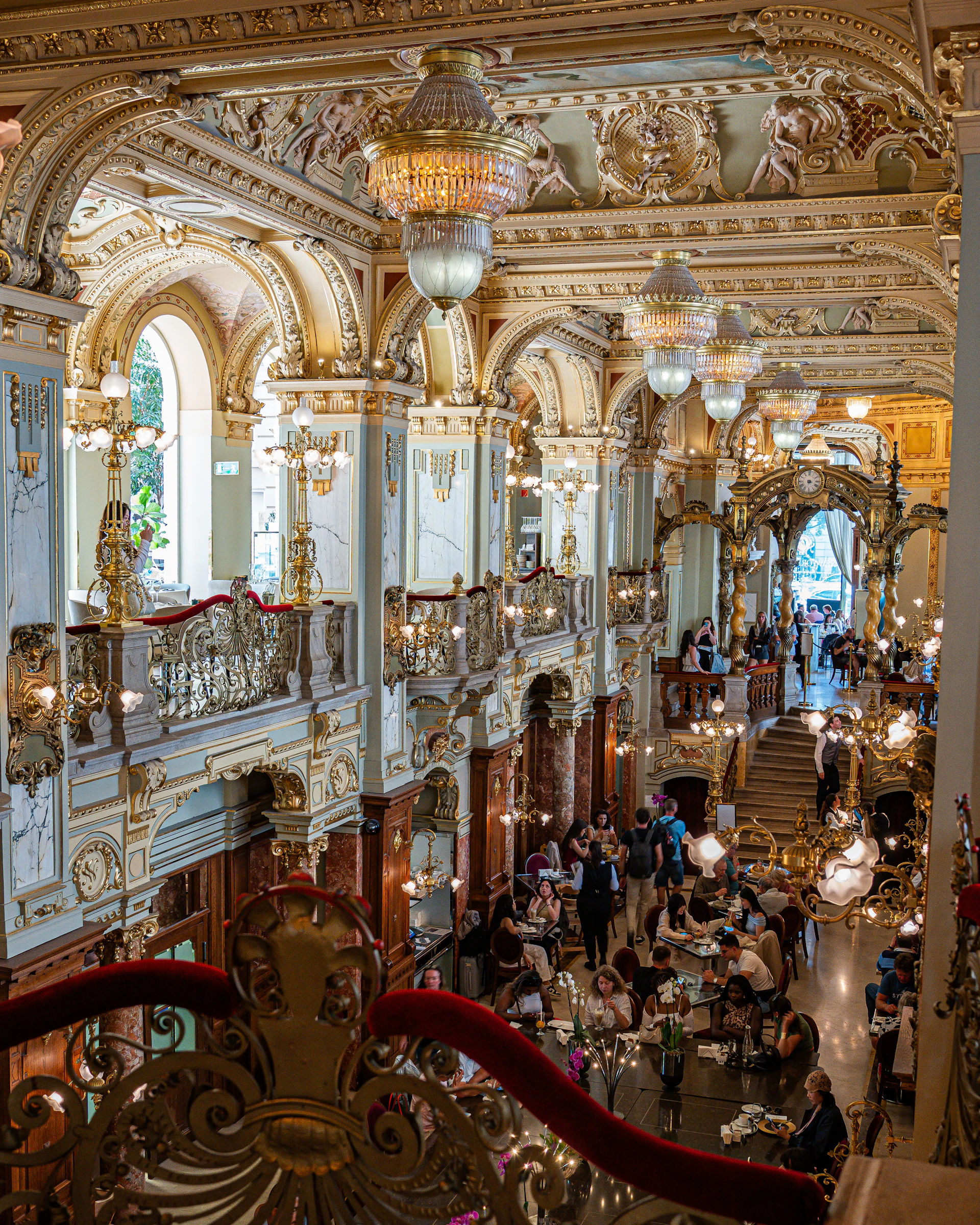 A grand and opulent cafe interior.