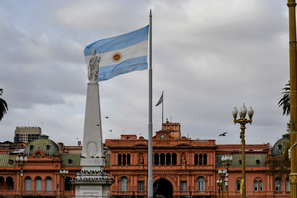 Argentine flag waving near the Casa Rosada presidential building in Buenos Aires