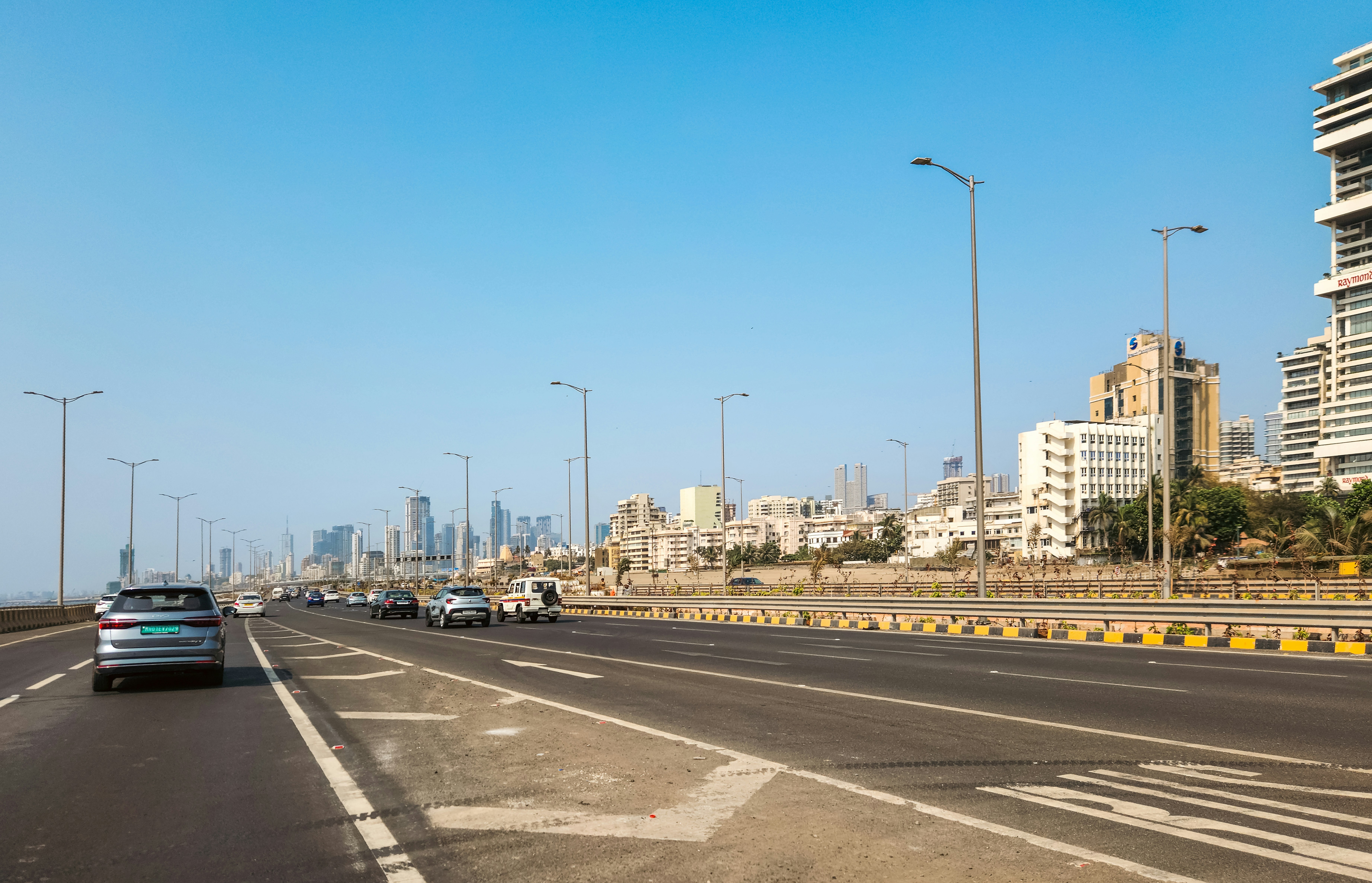 A car driving along a coastal road in Morocco with the ocean view.