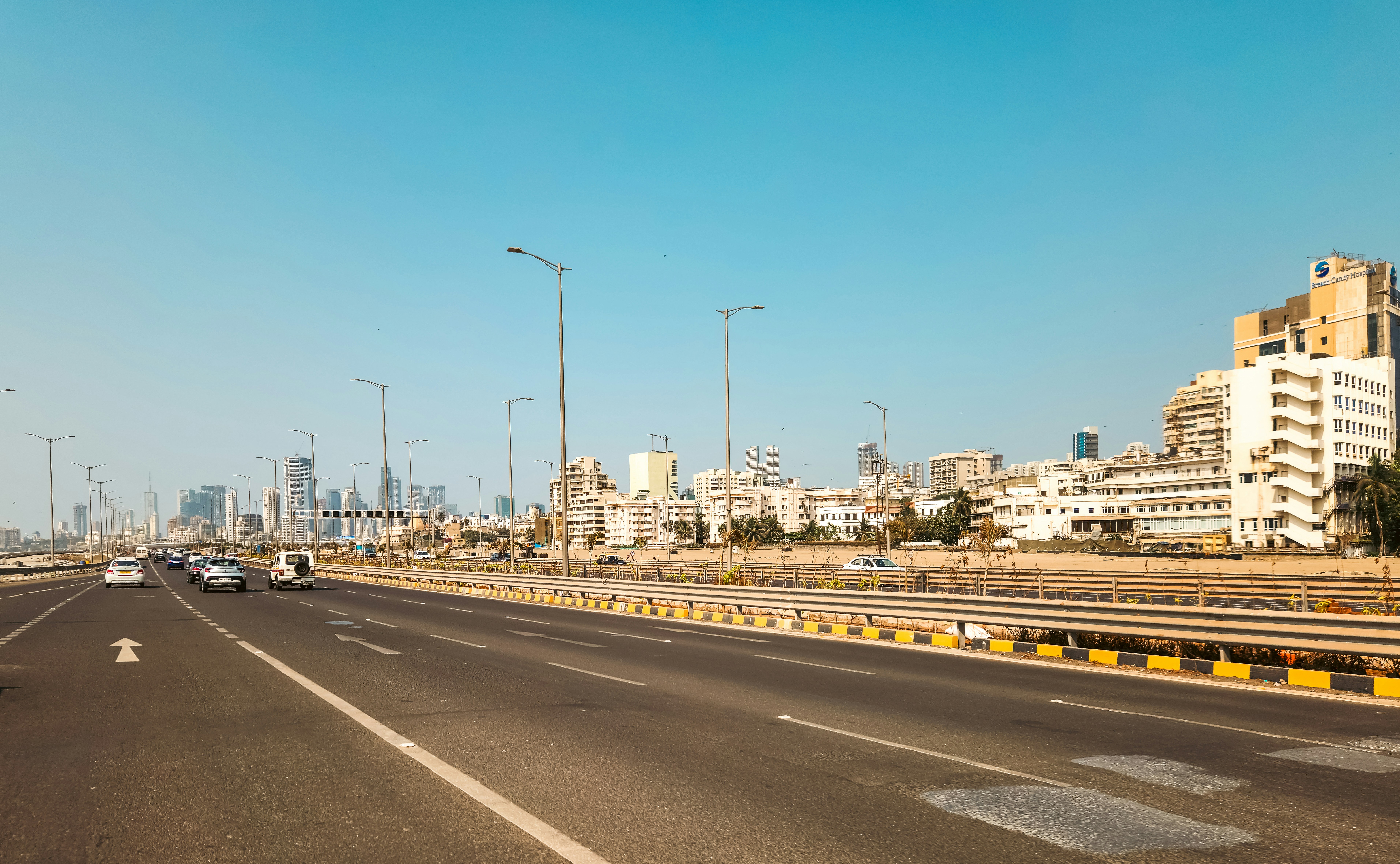 A highway leads toward a city skyline.