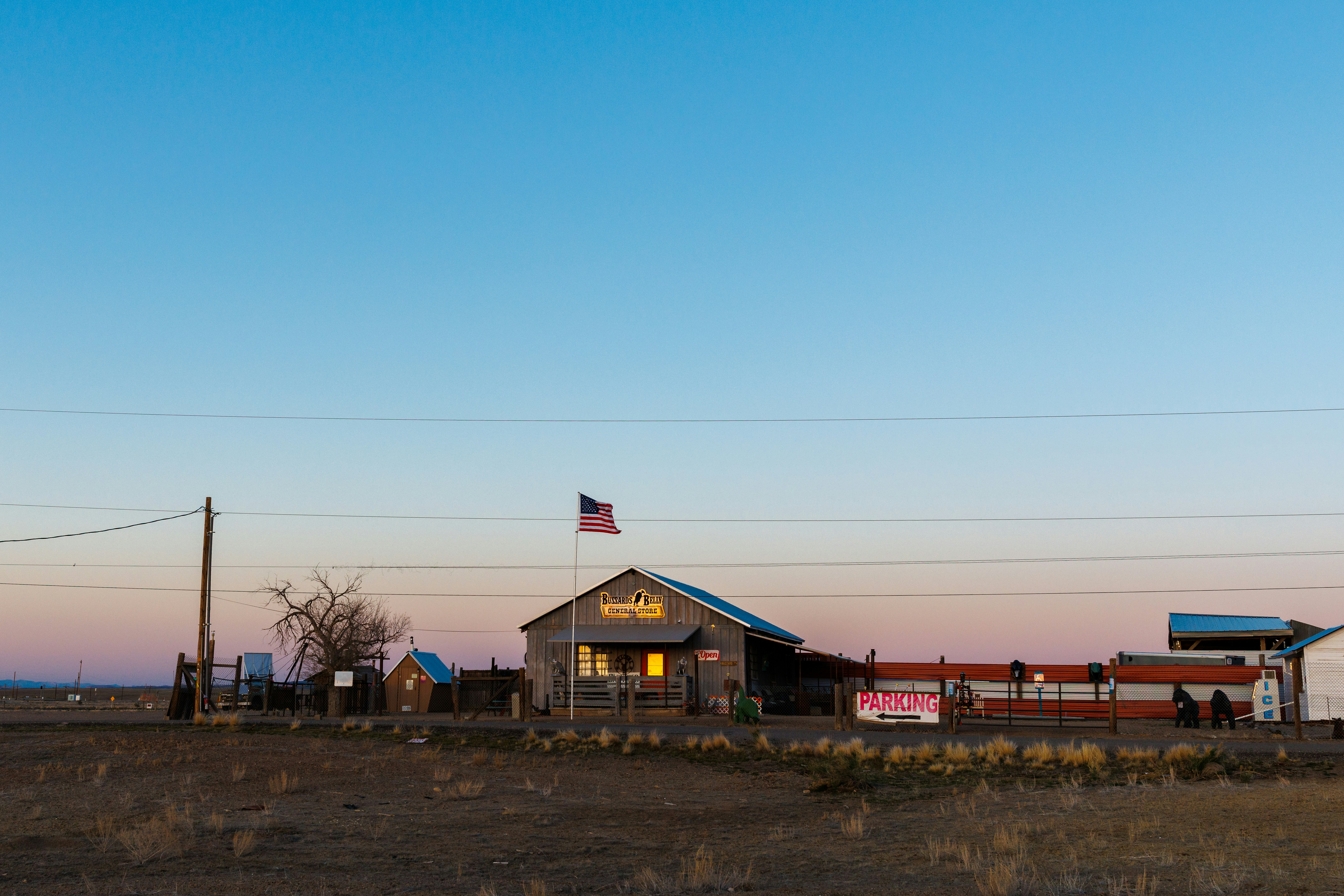 An old building with an american flag.