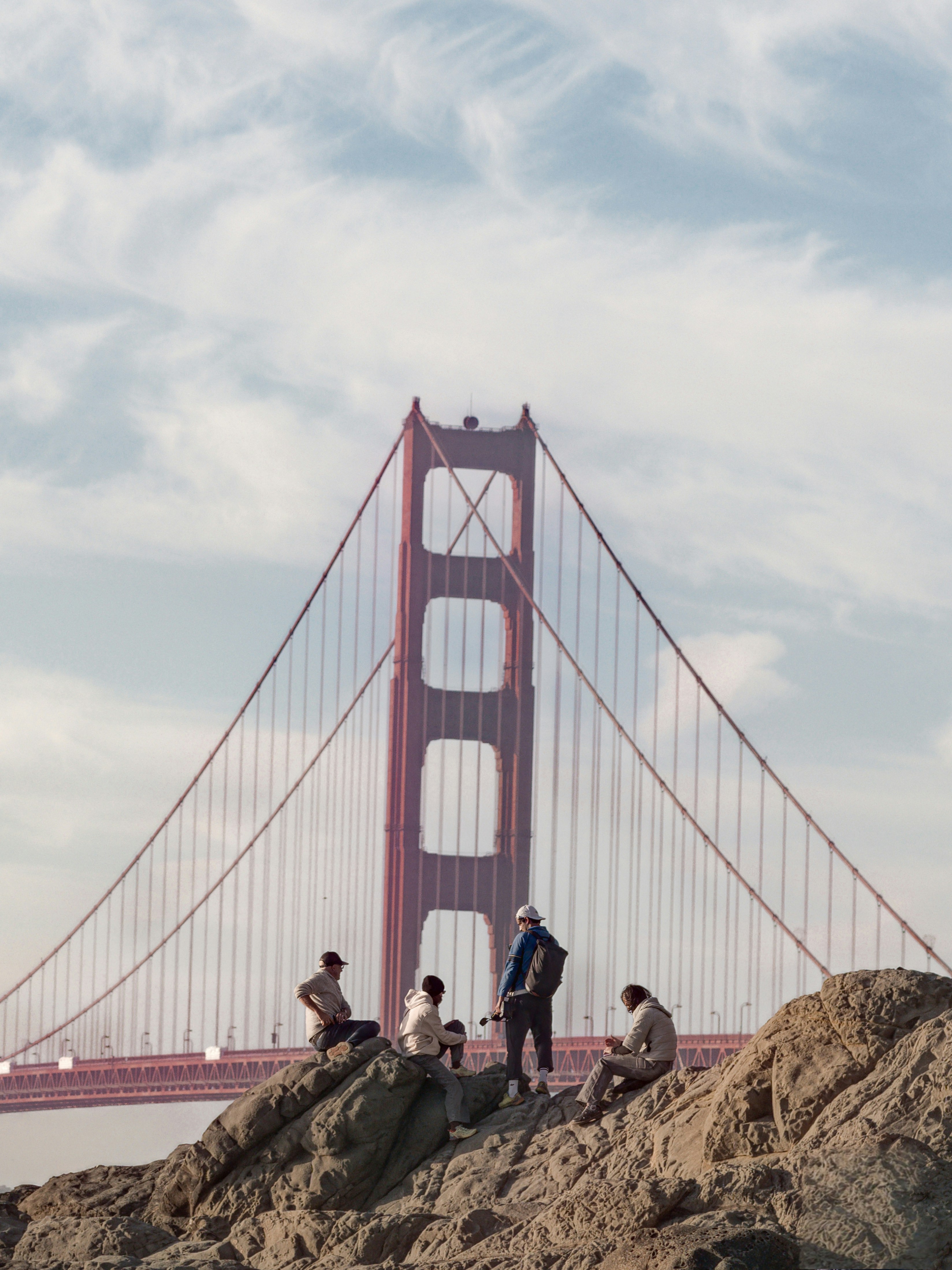 People are enjoying the view of the golden gate bridge.