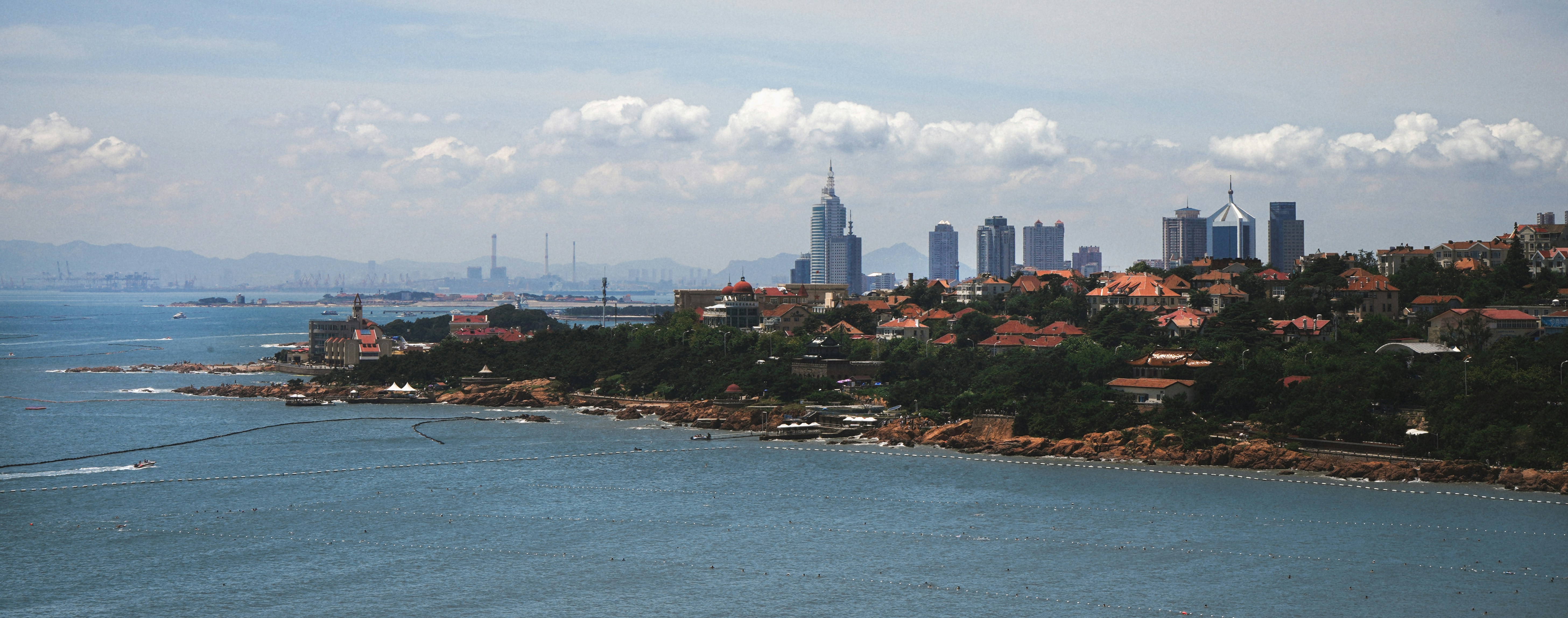 Cityscape view with water and buildings.