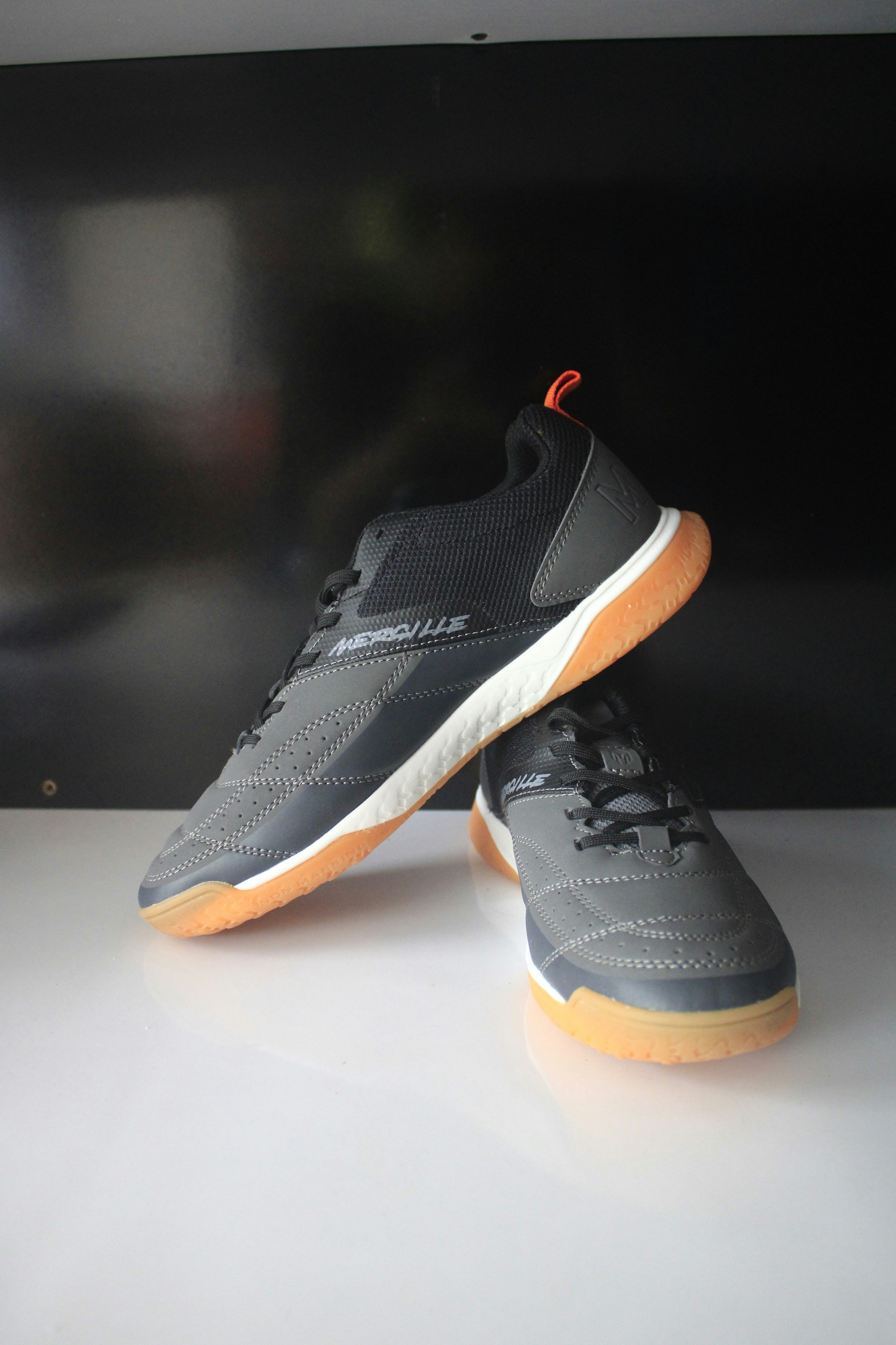 Pair of gray and black athletic shoes.