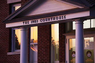 The 1903 courthouse is shown at sunset.
