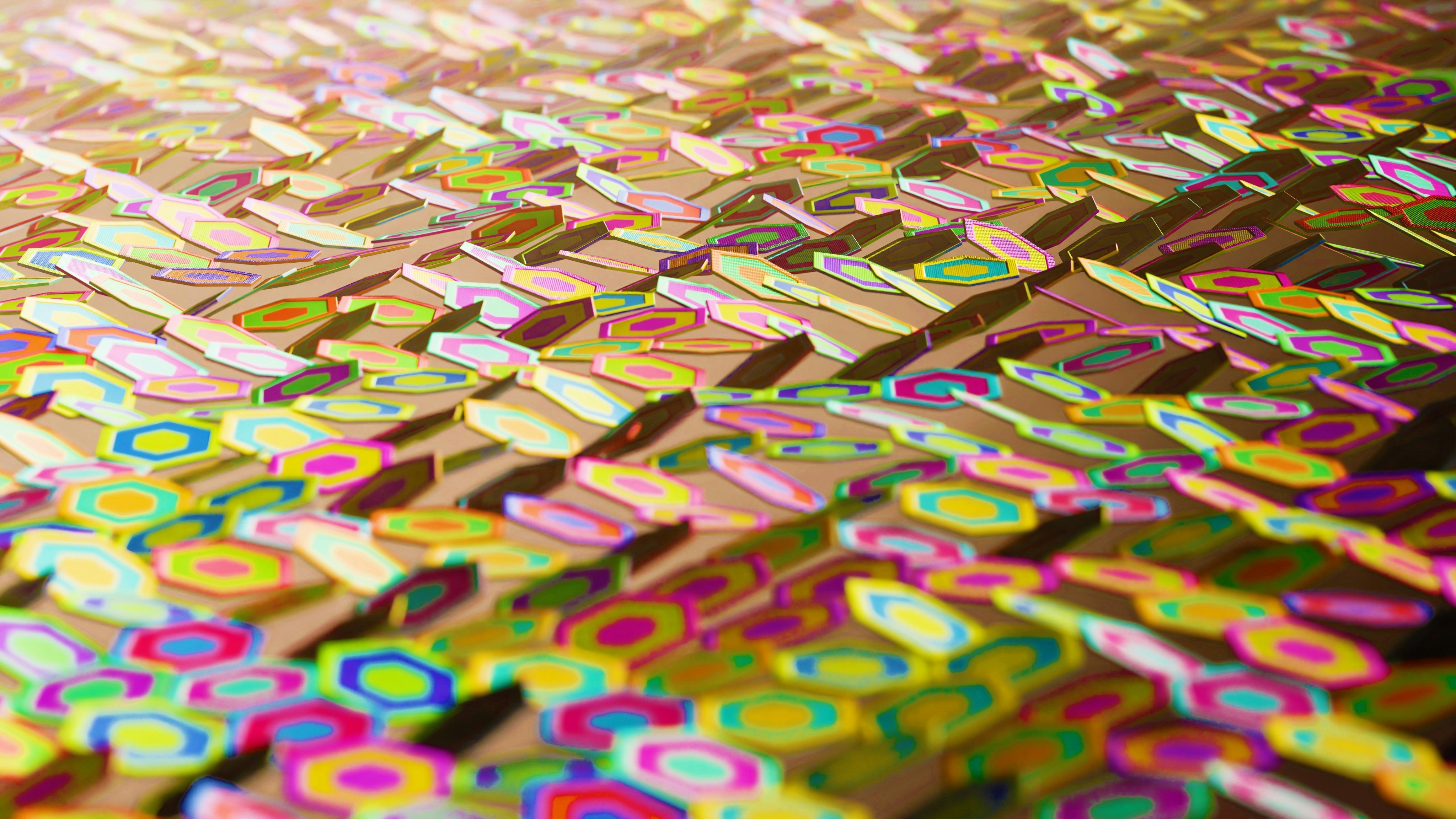 A close-up shows a colorful, geometric pattern.