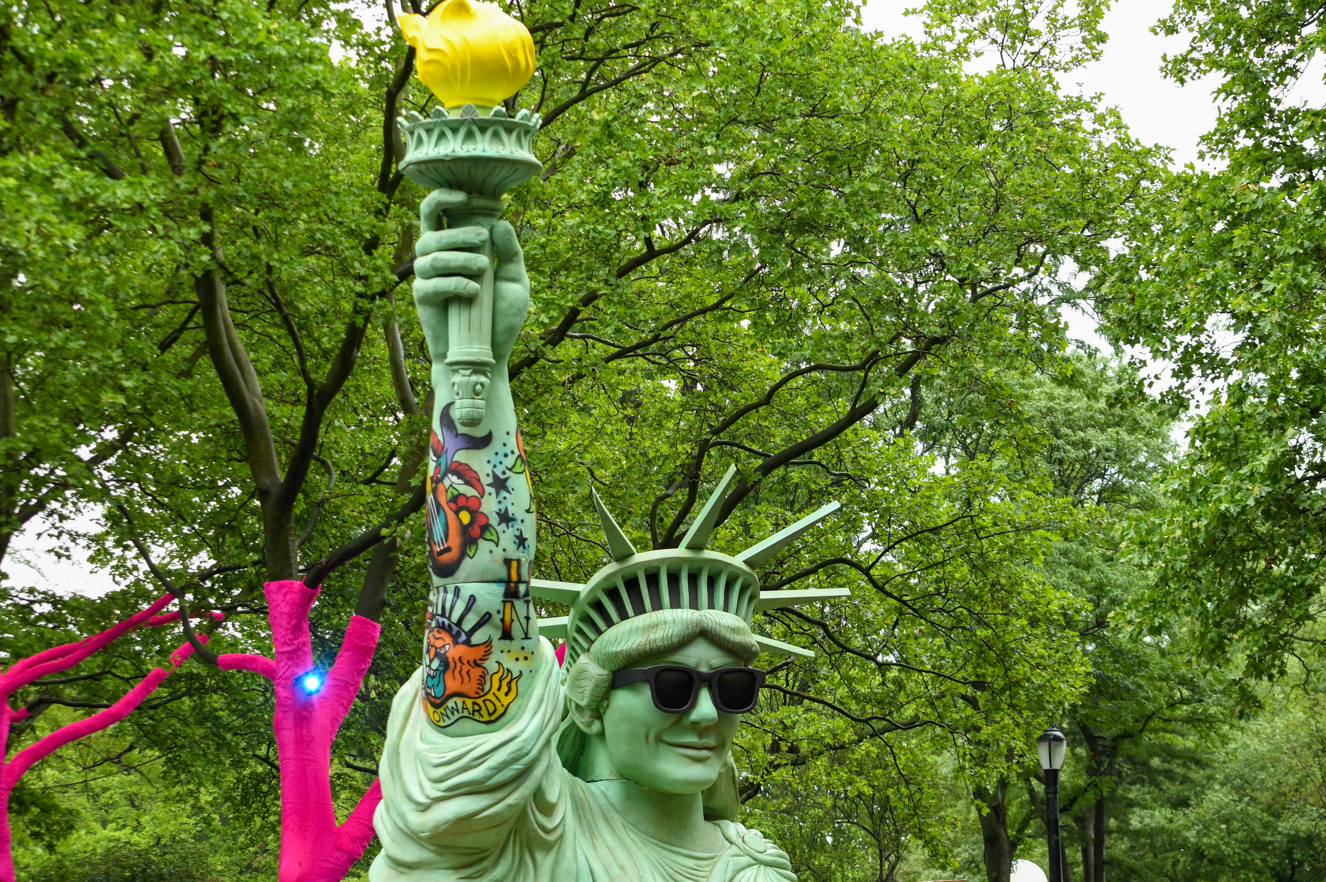 Lady liberty wears sunglasses with a quirky touch.