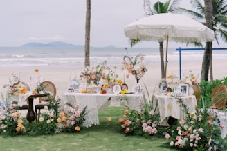 A beautiful beach wedding decoration is displayed.