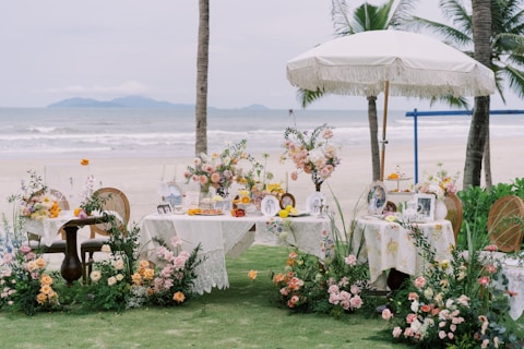 A beautiful beach wedding decoration is displayed.