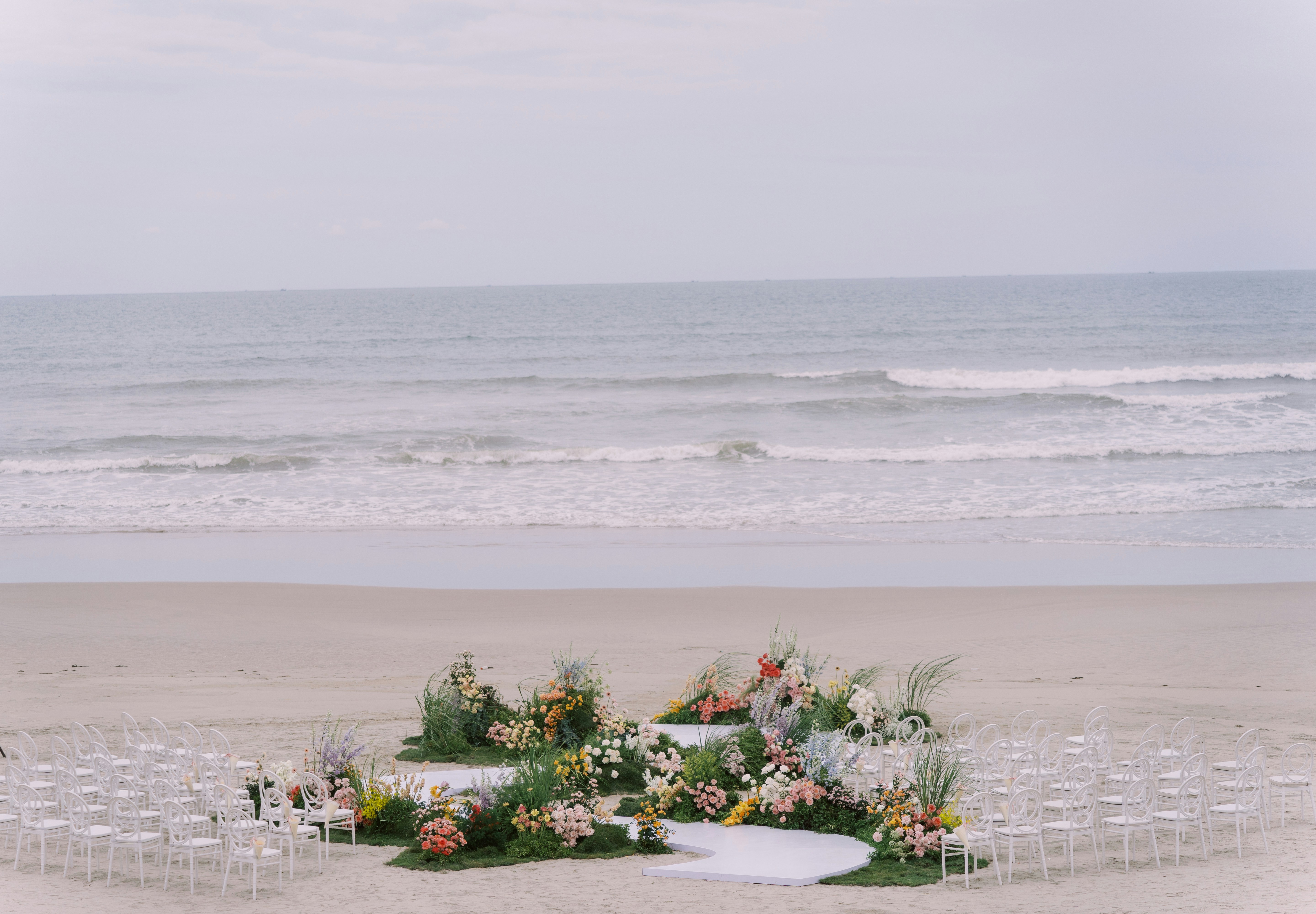 tropical beach wedding flowers and garden style arrangements