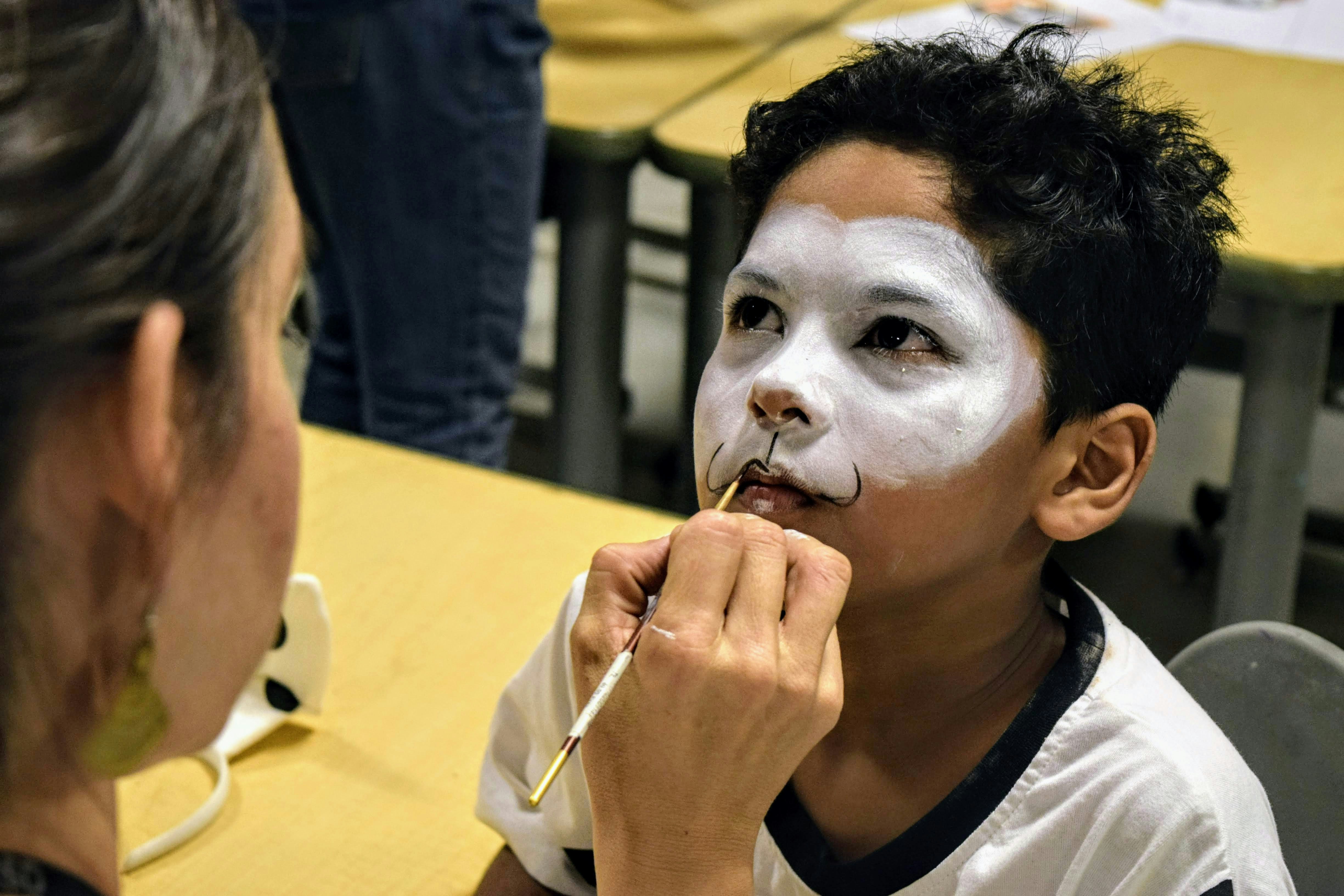 Someone is applying face paint on a child.