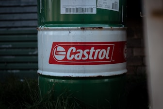 A castrol barrel sits outside.