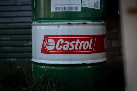 A castrol barrel sits outside.