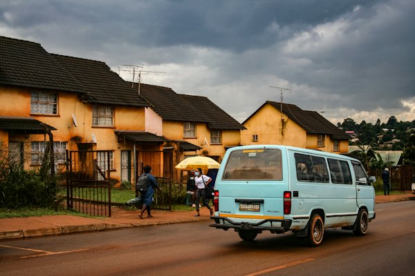 A minibus on a street of houses — Eswatini, Eswatini