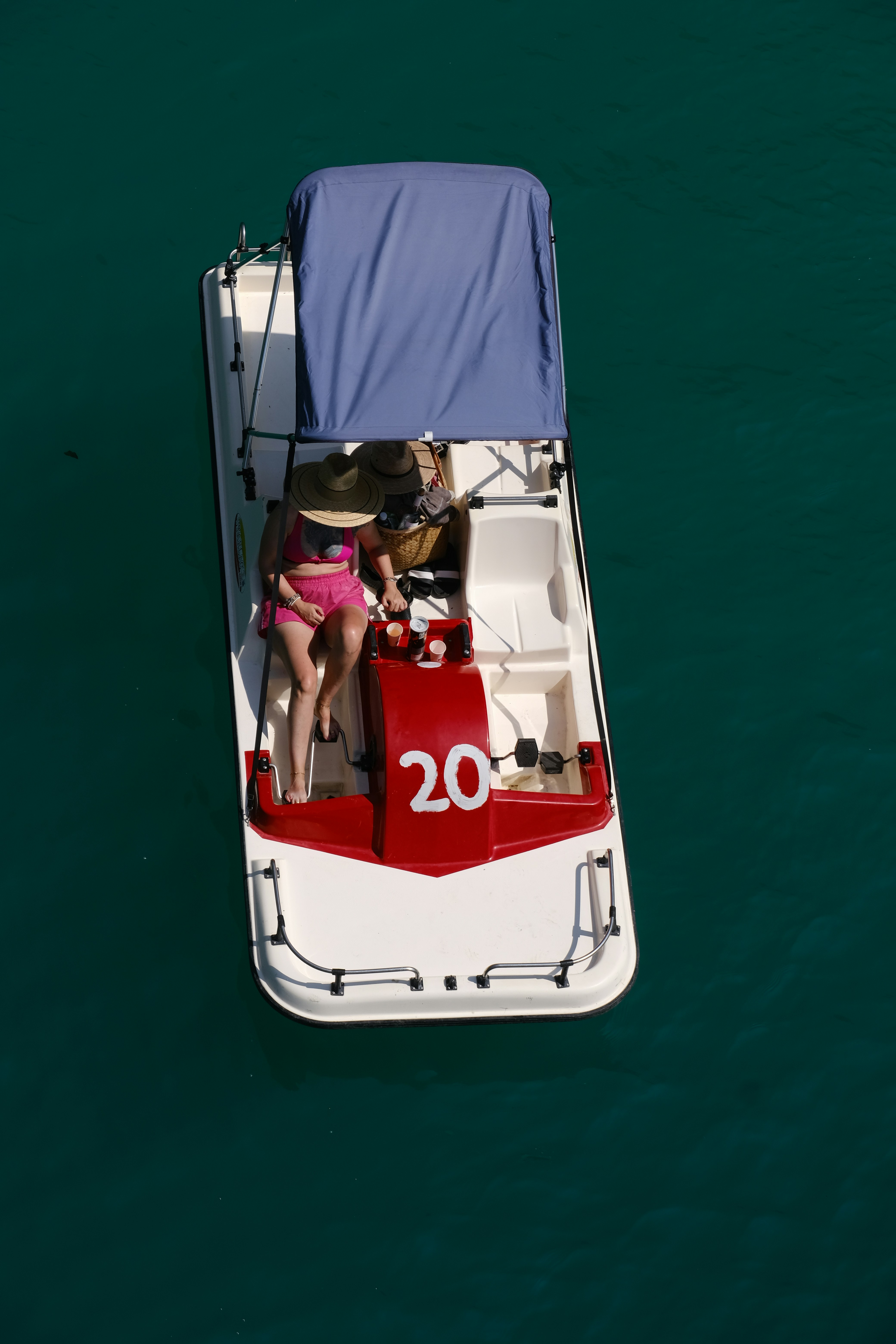 A person is riding a pedal boat on the water.
