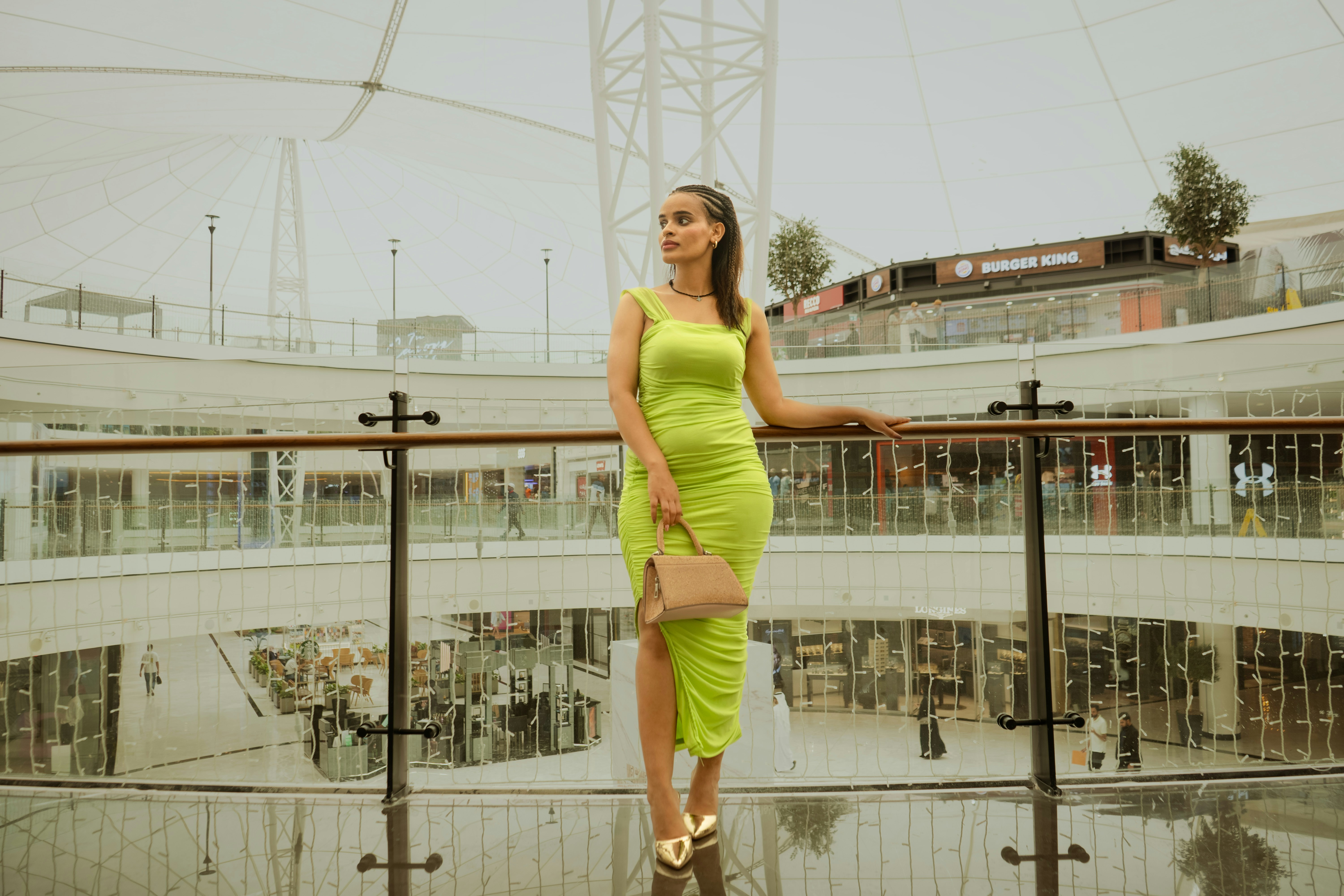 Woman in stylish green dress