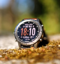 A smartwatch displays time, date, and other data.