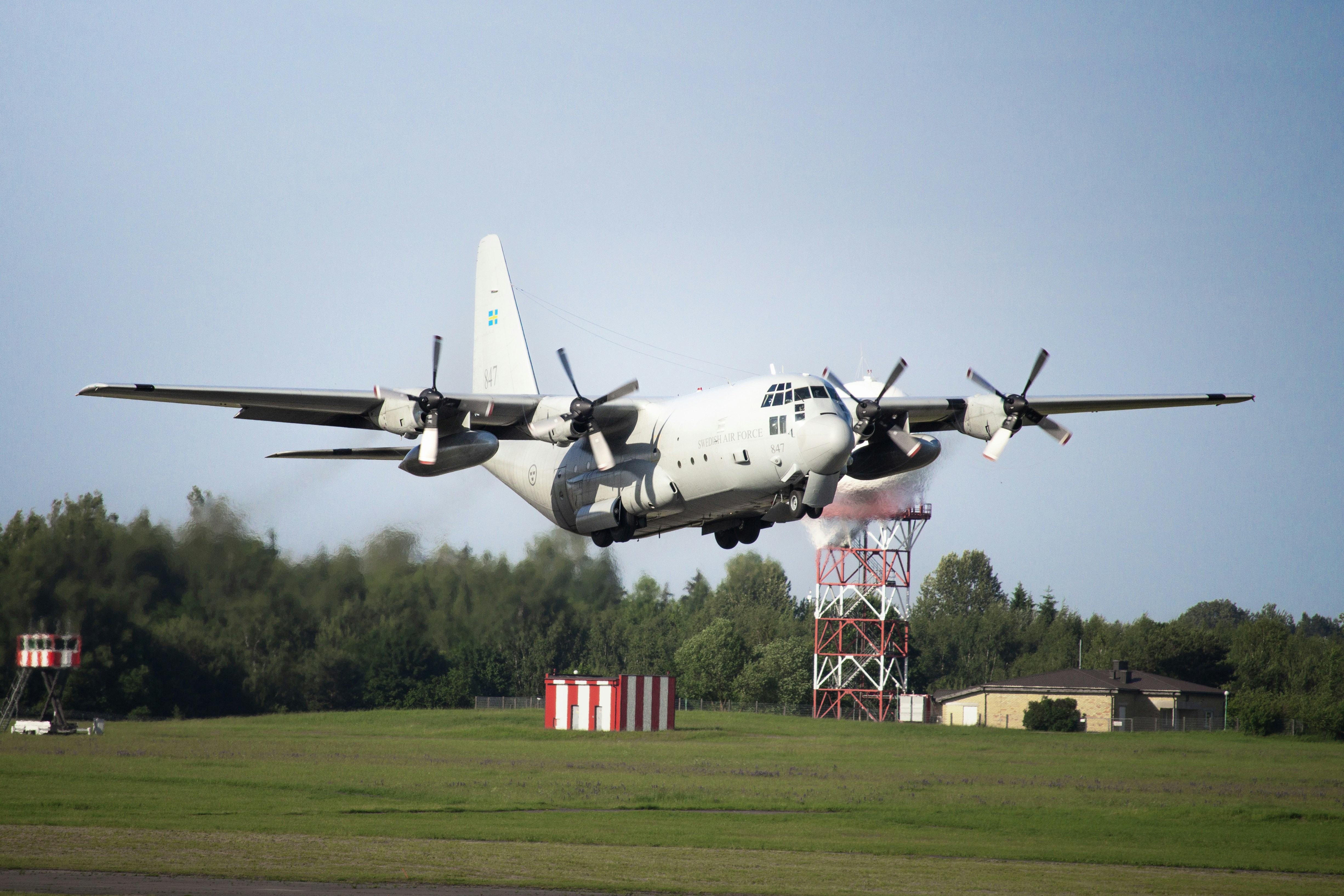 Military airplane takes off from the runway.