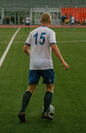 Soccer player in a white jersey with the number 15.