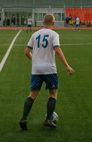 Soccer player in a white jersey with the number 15.