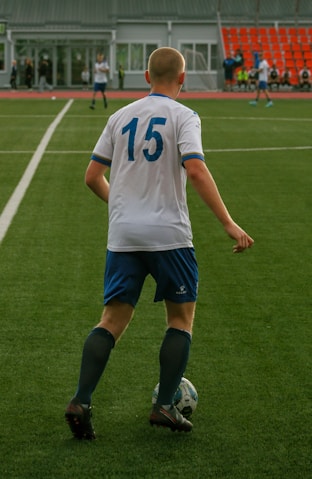 Soccer player in a white jersey with the number 15.