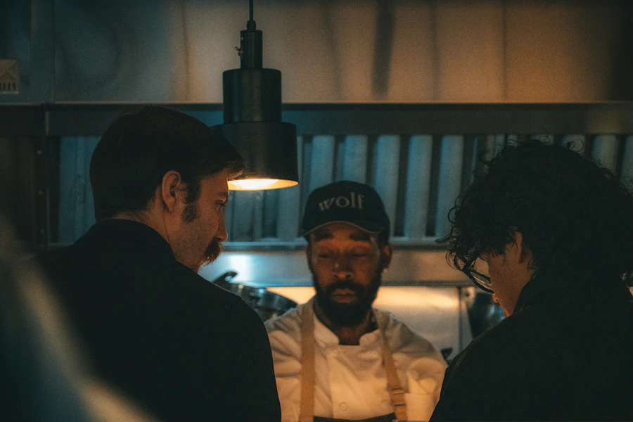 Chefs working together in a busy restaurant kitchen