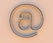 An "at" symbol on a beige background.