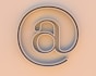 An "at" symbol on a beige background.