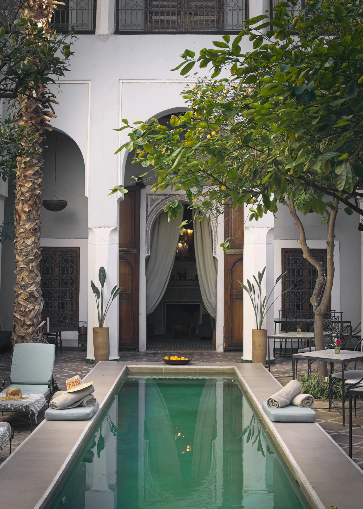 A tranquil tiled courtyard and pool inside a Marrakech riad