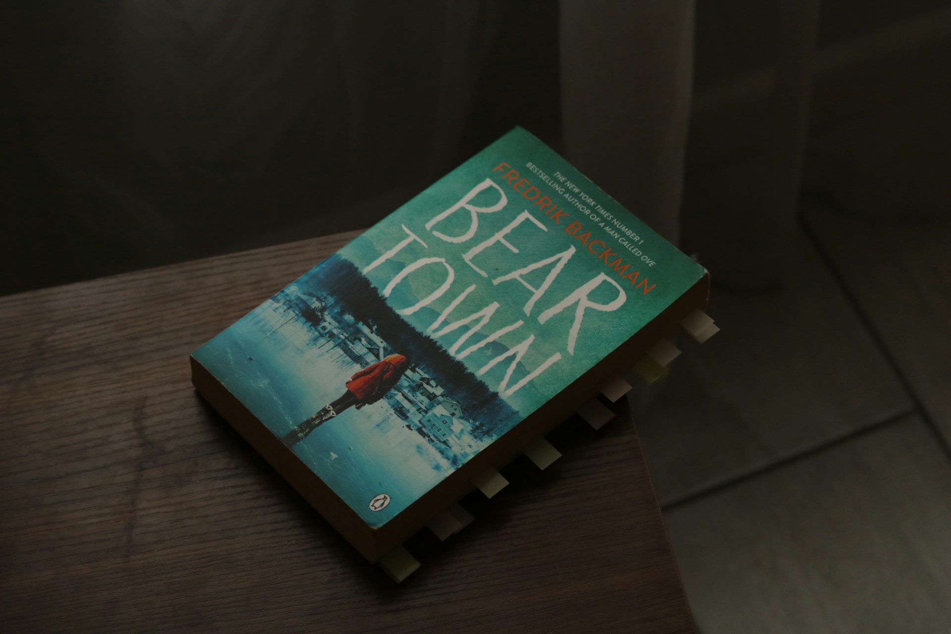 The book "beartown" is resting on a surface.