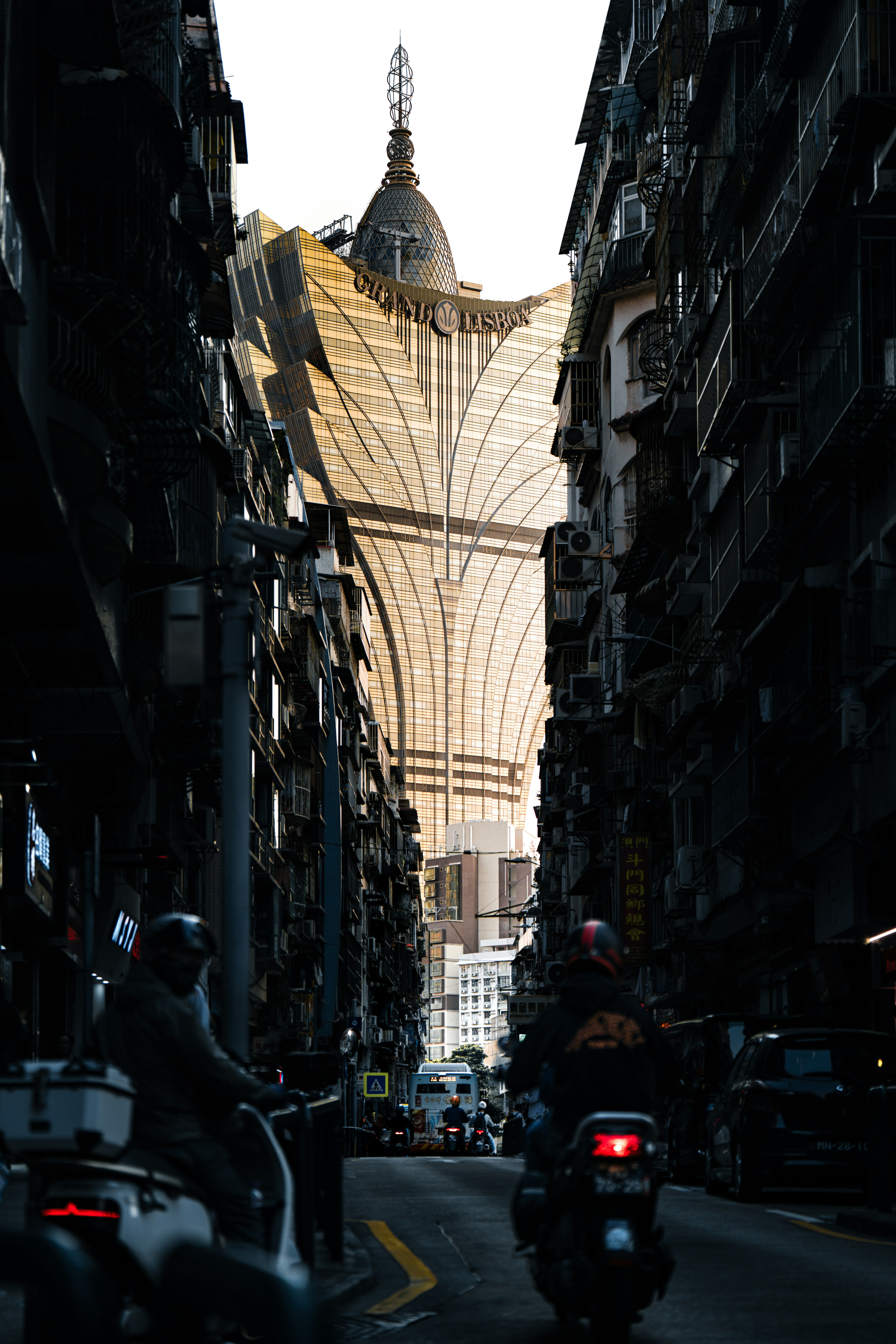Old street contrasting with a modern building.