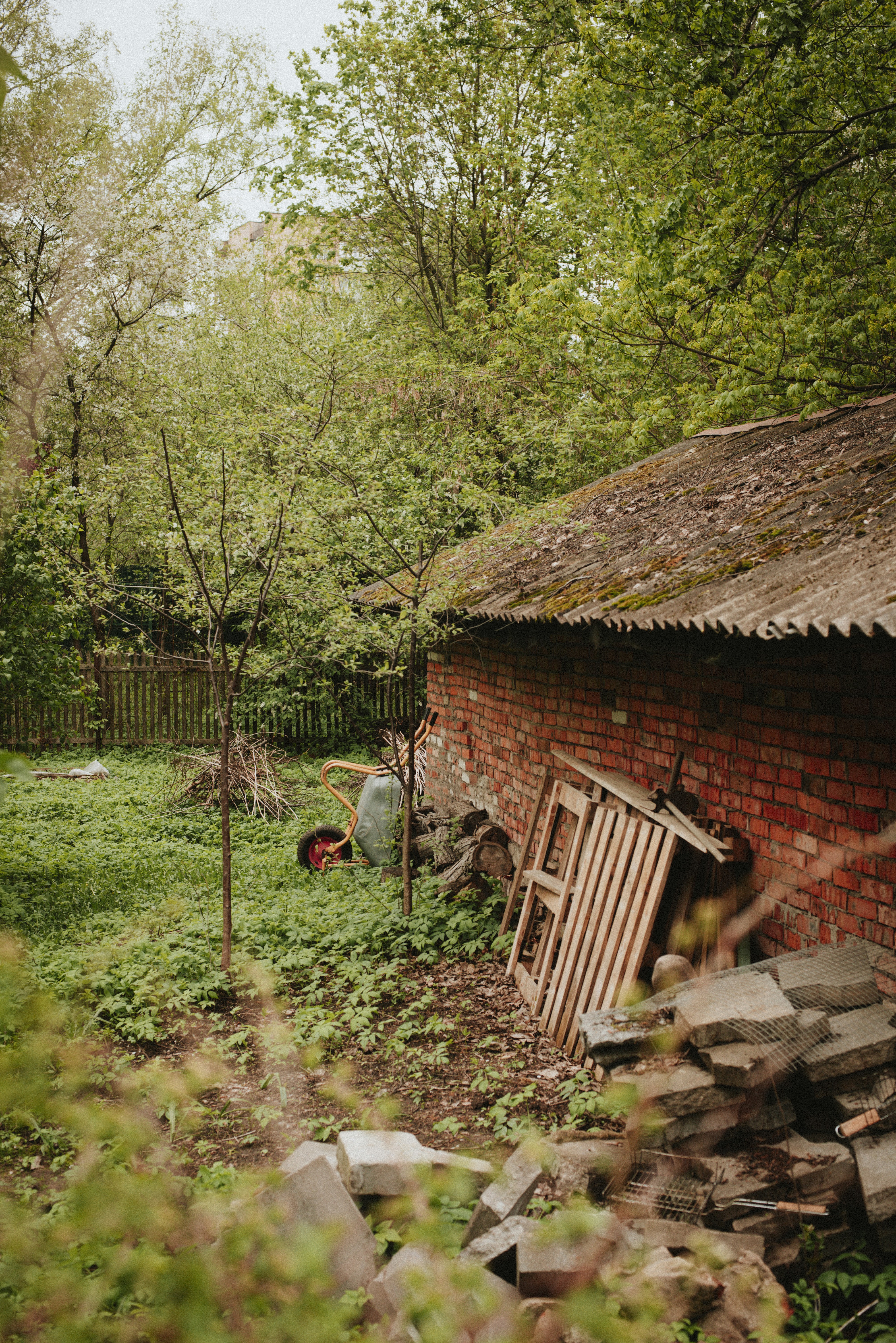 A brick building and green yard.