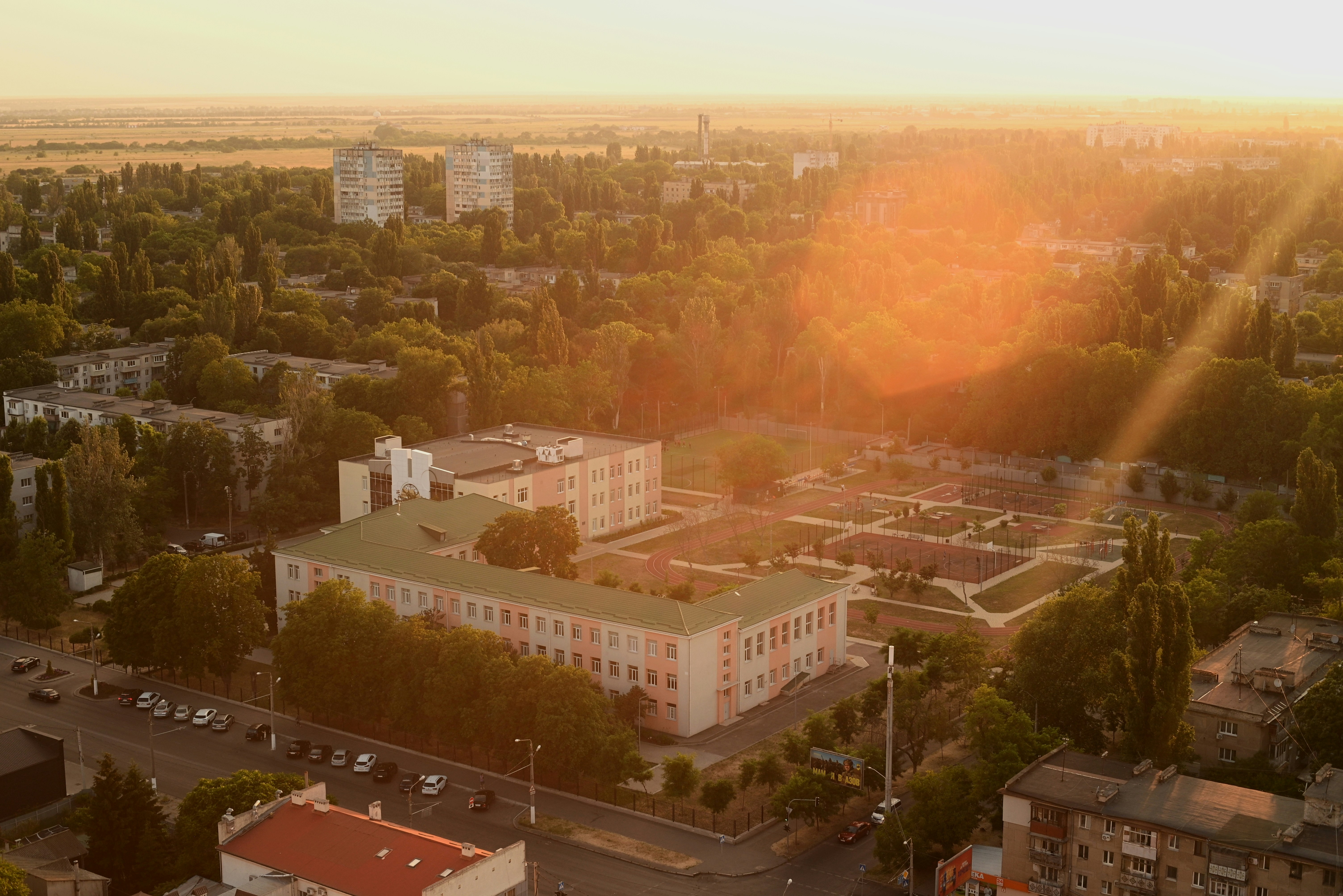 A sunny view of a city's buildings.