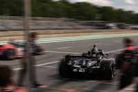 A formula 1 car speeds down the track.