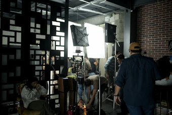 A film crew prepares for a shoot on set