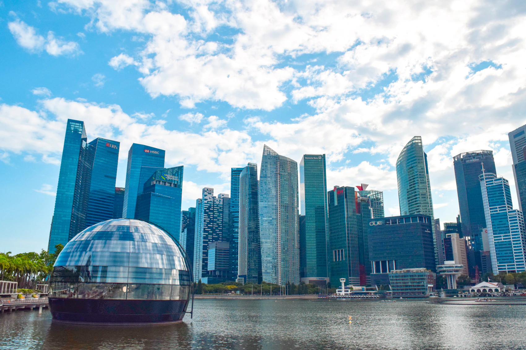 Modern Singapore skyline reflected across Marina Bay