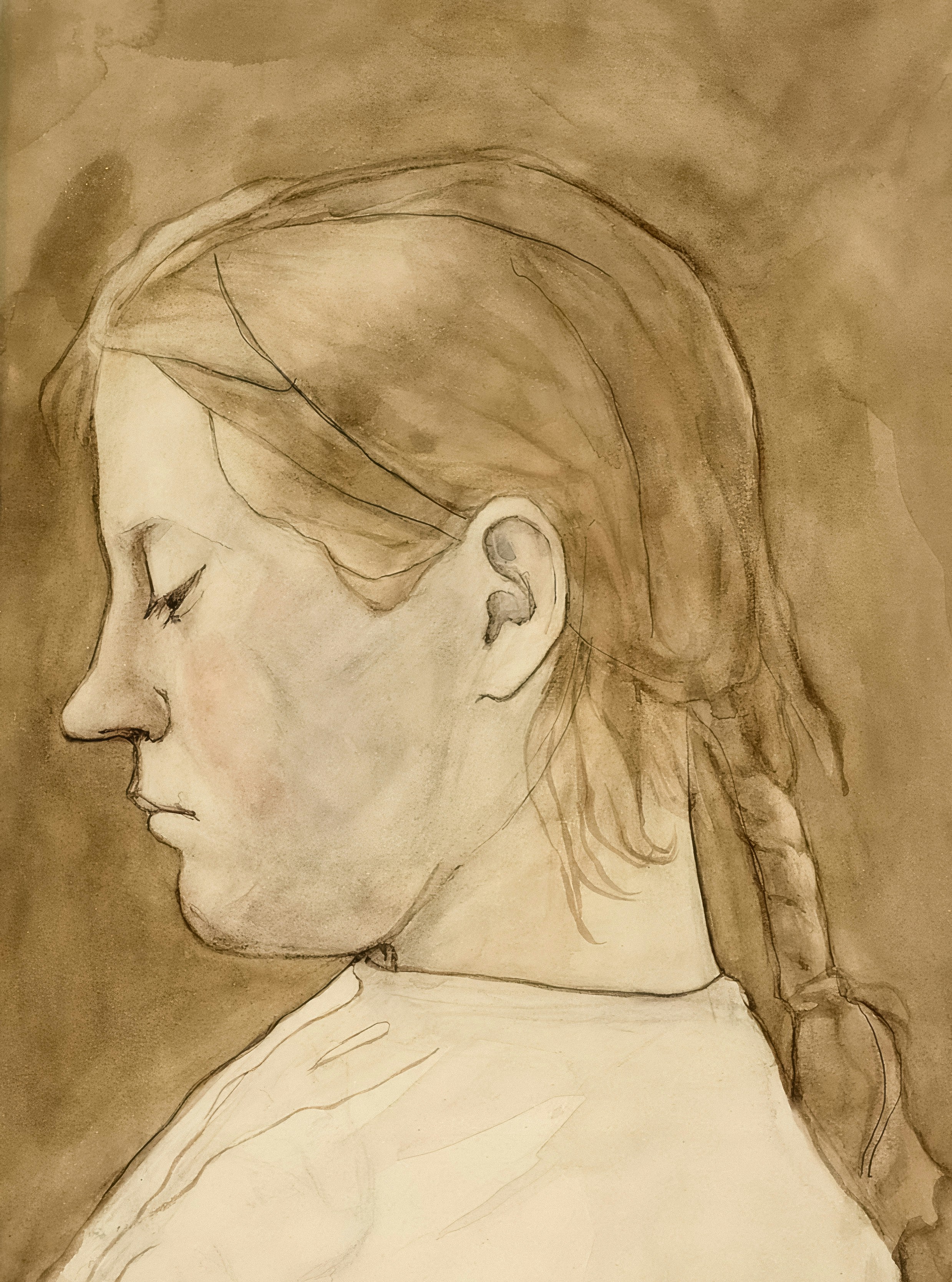 A young girl with braided hair in profile