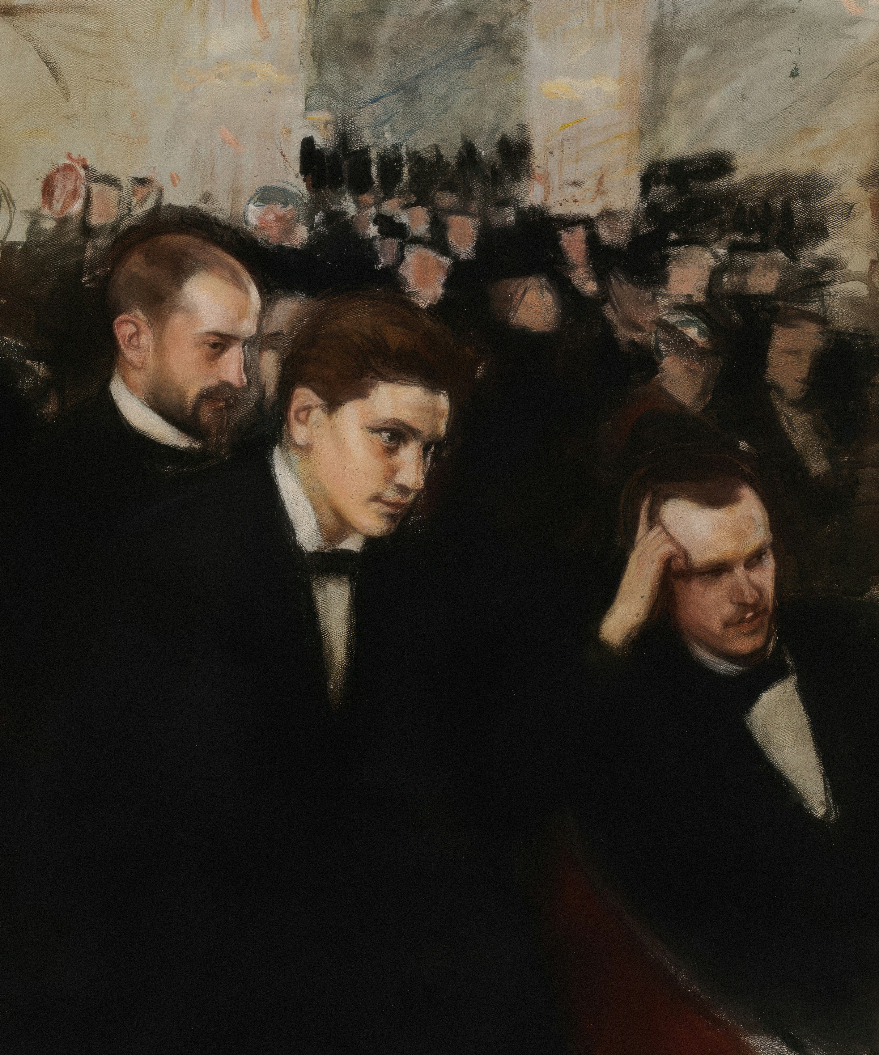Three men in formal attire in a crowd