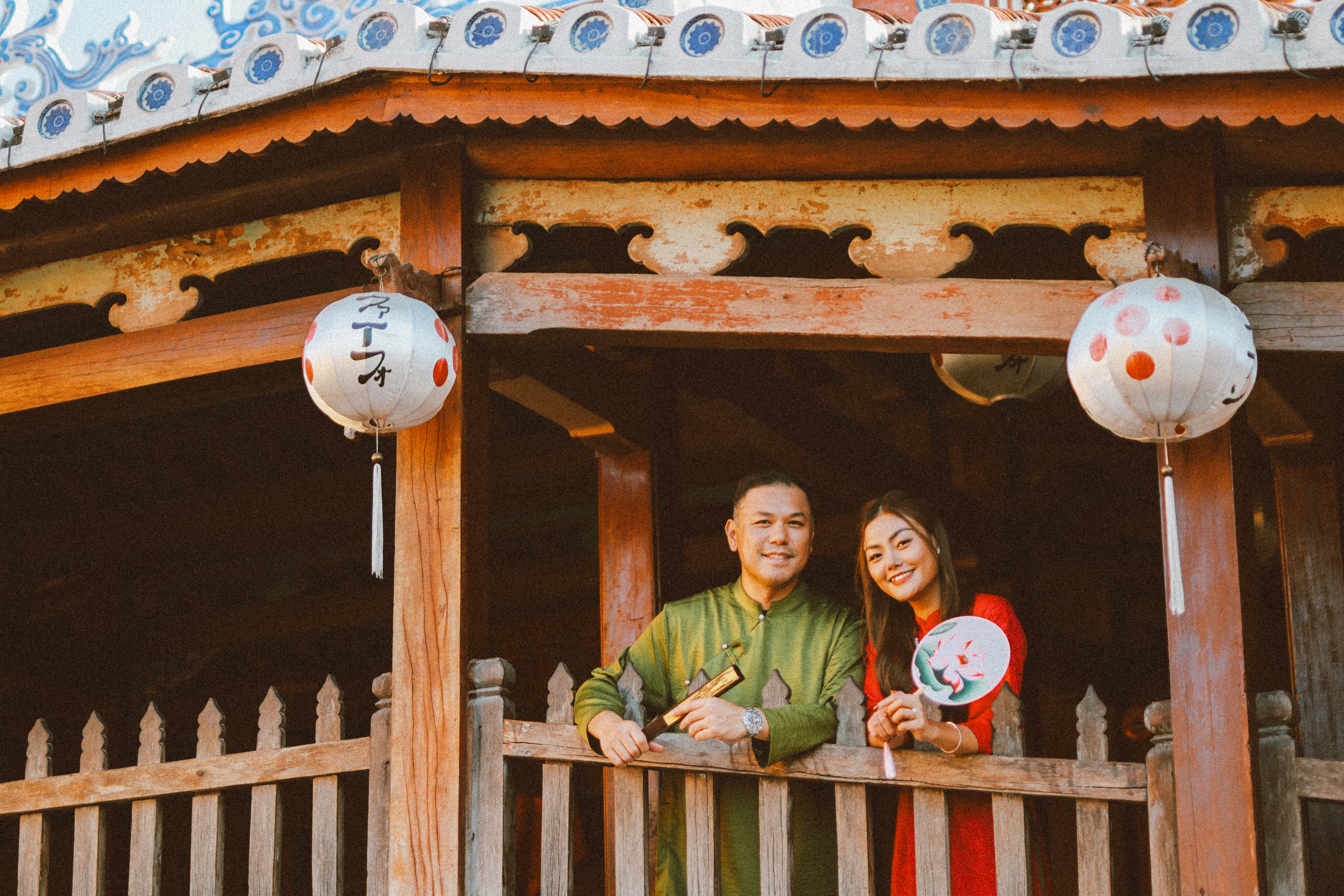 Couple posing together at a beautiful bridge.