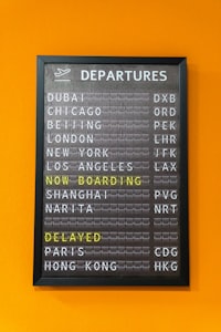 An airport departure board showing flight information